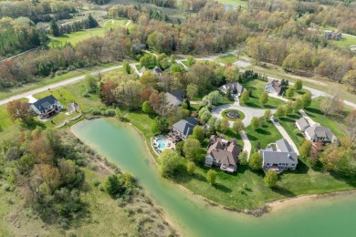 Experience refined waterfront living at its finest with this on Tullymore Golf Club in Michigan - for sale on GolfHomes.com, golf home, golf lot