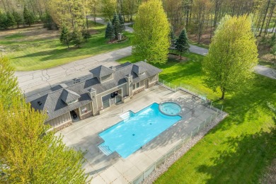Experience refined waterfront living at its finest with this on Tullymore Golf Club in Michigan - for sale on GolfHomes.com, golf home, golf lot