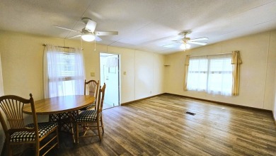Welcome to your perfect retirement oasis in the charming city of on Herons Glen Golf and Country Club in Florida - for sale on GolfHomes.com, golf home, golf lot