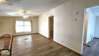 Welcome to your perfect retirement oasis in the charming city of on Herons Glen Golf and Country Club in Florida - for sale on GolfHomes.com, golf home, golf lot