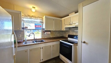 Welcome to your perfect retirement oasis in the charming city of on Herons Glen Golf and Country Club in Florida - for sale on GolfHomes.com, golf home, golf lot