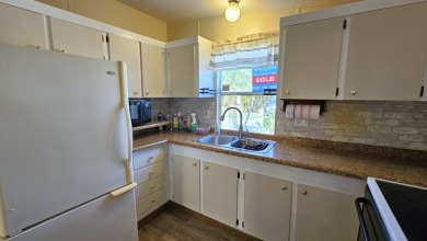 Welcome to your perfect retirement oasis in the charming city of on Herons Glen Golf and Country Club in Florida - for sale on GolfHomes.com, golf home, golf lot