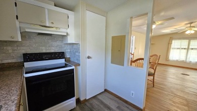 Welcome to your perfect retirement oasis in the charming city of on Herons Glen Golf and Country Club in Florida - for sale on GolfHomes.com, golf home, golf lot