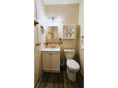 Welcome to your perfect retirement oasis in the charming city of on Herons Glen Golf and Country Club in Florida - for sale on GolfHomes.com, golf home, golf lot