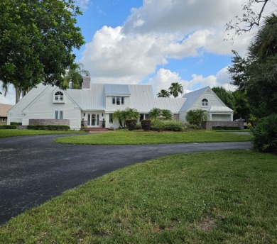 Welcome to one of Palm City's most charming Estate homes located on Martin Downs Country Club in Florida - for sale on GolfHomes.com, golf home, golf lot