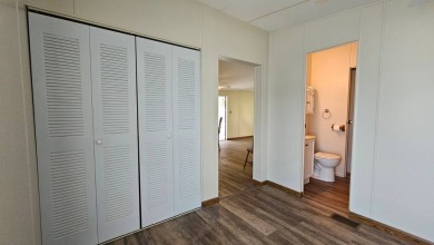 Welcome to your perfect retirement oasis in the charming city of on Herons Glen Golf and Country Club in Florida - for sale on GolfHomes.com, golf home, golf lot