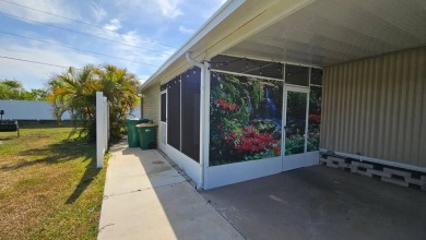 Welcome to your perfect retirement oasis in the charming city of on Herons Glen Golf and Country Club in Florida - for sale on GolfHomes.com, golf home, golf lot