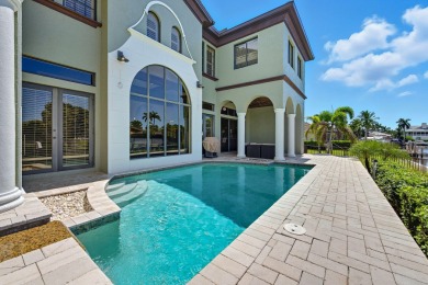 This stunning waterfront residence offers direct Gulf access on Island Country Club in Florida - for sale on GolfHomes.com, golf home, golf lot