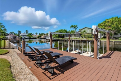 This stunning waterfront residence offers direct Gulf access on Island Country Club in Florida - for sale on GolfHomes.com, golf home, golf lot