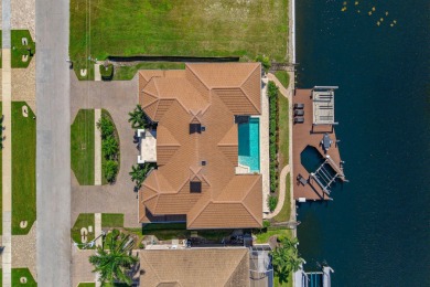 This stunning waterfront residence offers direct Gulf access on Island Country Club in Florida - for sale on GolfHomes.com, golf home, golf lot