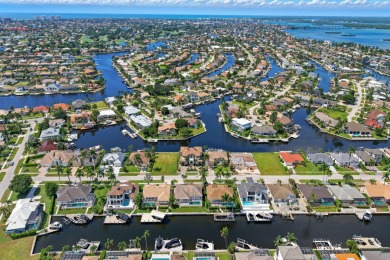 This stunning waterfront residence offers direct Gulf access on Island Country Club in Florida - for sale on GolfHomes.com, golf home, golf lot