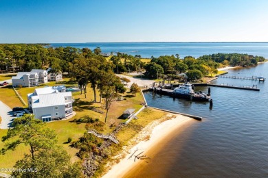 This beautifully updated two-bedroom, two-bath second-floor on Minnesott Golf and Country Club in North Carolina - for sale on GolfHomes.com, golf home, golf lot