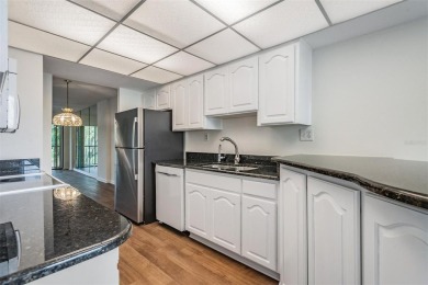 This spacious, light and bright fourth floor condo has a lovely on Cove Cay Country Club in Florida - for sale on GolfHomes.com, golf home, golf lot