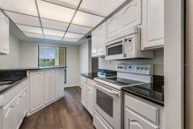 This spacious, light and bright fourth floor condo has a lovely on Cove Cay Country Club in Florida - for sale on GolfHomes.com, golf home, golf lot