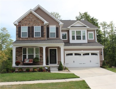 Experience elegance and comfort in this stunning stone-front on Club Walden in Ohio - for sale on GolfHomes.com, golf home, golf lot