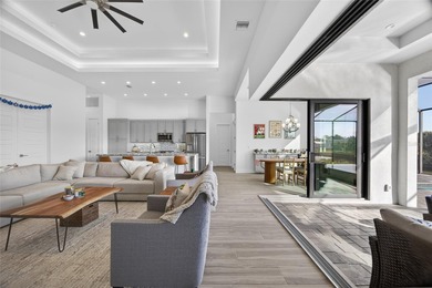 PRIME WATERFRONT IN CAPE CORAL! CONTEMPORARY 3 BEDROOM PLUS DEN on Burnt Store Golf Club in Florida - for sale on GolfHomes.com, golf home, golf lot