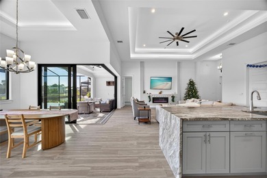 PRIME WATERFRONT IN CAPE CORAL! CONTEMPORARY 3 BEDROOM PLUS DEN on Burnt Store Golf Club in Florida - for sale on GolfHomes.com, golf home, golf lot