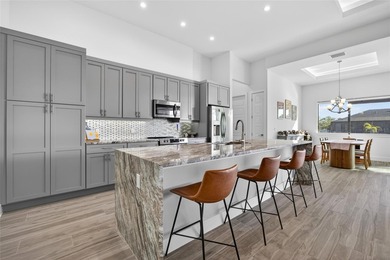 PRIME WATERFRONT IN CAPE CORAL! CONTEMPORARY 3 BEDROOM PLUS DEN on Burnt Store Golf Club in Florida - for sale on GolfHomes.com, golf home, golf lot