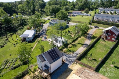 Experience modern sustainability in this brand-new NET-ZERO on Crowne Plaza Tennis and Golf Resort in North Carolina - for sale on GolfHomes.com, golf home, golf lot