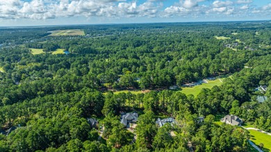 Nestled in the exclusive, gated golf course community of Dunes on Dunes West Golf Club in South Carolina - for sale on GolfHomes.com, golf home, golf lot