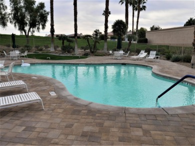 This condo features a premium location with lake, fairway and on Palm Royale Country Club in California - for sale on GolfHomes.com, golf home, golf lot