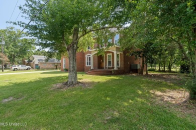 Nestled alongside the greens of the Pascagoula Country Club golf on Pascagoula Country Club in Mississippi - for sale on GolfHomes.com, golf home, golf lot