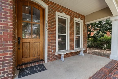Nestled alongside the greens of the Pascagoula Country Club golf on Pascagoula Country Club in Mississippi - for sale on GolfHomes.com, golf home, golf lot