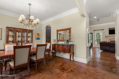 Nestled alongside the greens of the Pascagoula Country Club golf on Pascagoula Country Club in Mississippi - for sale on GolfHomes.com, golf home, golf lot