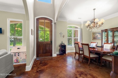 Nestled alongside the greens of the Pascagoula Country Club golf on Pascagoula Country Club in Mississippi - for sale on GolfHomes.com, golf home, golf lot
