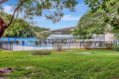 Bright first floor condo in Wynmoor, a gated 55 plus community on Wynmoor Golf Course in Florida - for sale on GolfHomes.com, golf home, golf lot