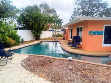 Gorgeous Dunedin pool home for sale. This house is located in on The Dunedin Country Club in Florida - for sale on GolfHomes.com, golf home, golf lot