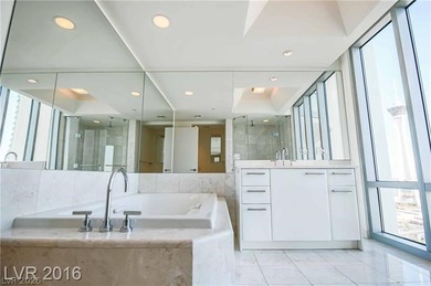 BEST PRICED HIGH FLOOR RESIDENCE w/ PHENOMENAL VIEWS OF THE on Las Vegas Country Club in Nevada - for sale on GolfHomes.com, golf home, golf lot