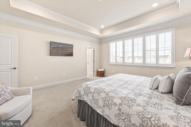 Welcome to 24321 Blue Crab Ave, a three-year-young town home on The Peninsula Golf and Country Club in Delaware - for sale on GolfHomes.com, golf home, golf lot