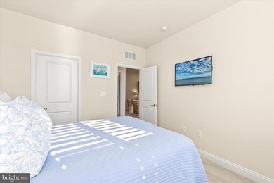 Welcome to 24321 Blue Crab Ave, a three-year-young town home on The Peninsula Golf and Country Club in Delaware - for sale on GolfHomes.com, golf home, golf lot