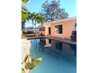 Gorgeous Dunedin pool home for sale. This house is located in on The Dunedin Country Club in Florida - for sale on GolfHomes.com, golf home, golf lot