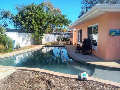 Gorgeous Dunedin pool home for sale. This house is located in on The Dunedin Country Club in Florida - for sale on GolfHomes.com, golf home, golf lot