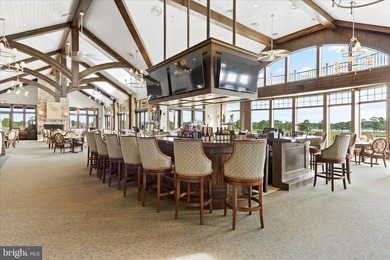 Welcome to 24321 Blue Crab Ave, a three-year-young town home on The Peninsula Golf and Country Club in Delaware - for sale on GolfHomes.com, golf home, golf lot