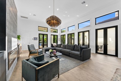 Located in Boca Grove, this two-story Mediterranean residence on Boca Grove Golf and Tennis in Florida - for sale on GolfHomes.com, golf home, golf lot