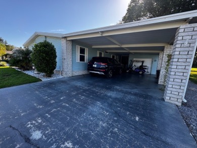 Welcome to this beautifully maintained and fully remodeled home on Hamptons Golf Club in Florida - for sale on GolfHomes.com, golf home, golf lot
