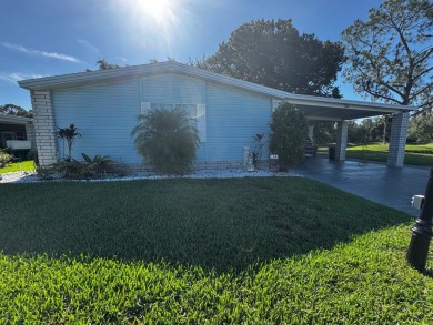 Welcome to this beautifully maintained and fully remodeled home on Hamptons Golf Club in Florida - for sale on GolfHomes.com, golf home, golf lot