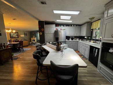 Welcome to this beautifully maintained and fully remodeled home on Hamptons Golf Club in Florida - for sale on GolfHomes.com, golf home, golf lot