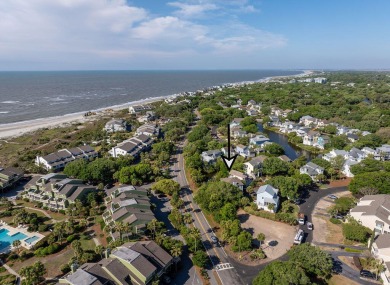 Just bring your suitcase - this turnkey home is tucked away in a on Wild Dunes Harbor Golf Resort in South Carolina - for sale on GolfHomes.com, golf home, golf lot
