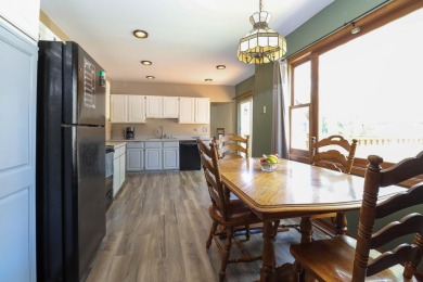 Surrounded by lakes and located on a golf course, this home is on Nippersink Golf Resort in Wisconsin - for sale on GolfHomes.com, golf home, golf lot