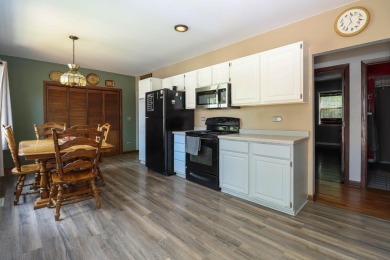 Surrounded by lakes and located on a golf course, this home is on Nippersink Golf Resort in Wisconsin - for sale on GolfHomes.com, golf home, golf lot