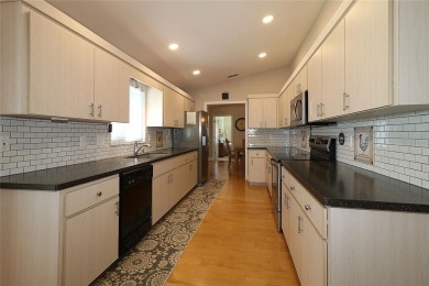 Well maintained ranch styled home is located closer to the front on Eagle Ridge At Spruce Creek Country Club in Florida - for sale on GolfHomes.com, golf home, golf lot