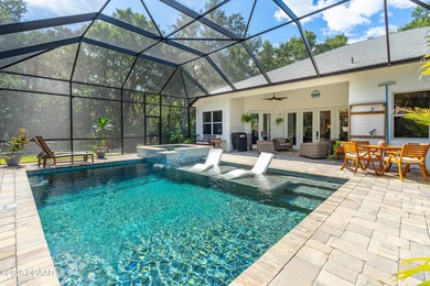 Stunning Halifax Plantation golf course custom pool home on a on Halifax Plantation Golf Club in Florida - for sale on GolfHomes.com, golf home, golf lot