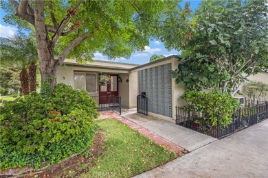 Sun-splashed Barcelona end unit with leafy outlooks, a private on Laguna Woods Village Golf Course in California - for sale on GolfHomes.com, golf home, golf lot