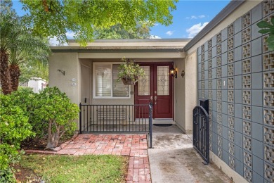 Sun-splashed Barcelona end unit with leafy outlooks, a private on Laguna Woods Village Golf Course in California - for sale on GolfHomes.com, golf home, golf lot