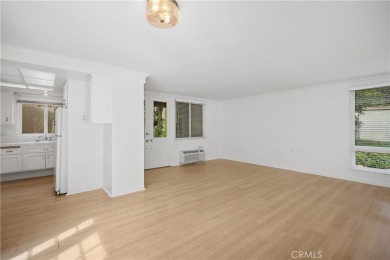 Sun-splashed Barcelona end unit with leafy outlooks, a private on Laguna Woods Village Golf Course in California - for sale on GolfHomes.com, golf home, golf lot