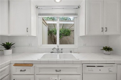 Sun-splashed Barcelona end unit with leafy outlooks, a private on Laguna Woods Village Golf Course in California - for sale on GolfHomes.com, golf home, golf lot